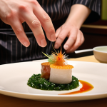 **

A beautifully plated multi-course Japanese meal in a high-end restaurant setting. Focus on seasonal ingredients and the artistic presentation. Consider elements like delicate porcelain, fresh flowers, and soft lighting. The ambiance should be calm and refined, reflecting Japanese aesthetics. Perhaps include a glimpse of a skilled chef in the background meticulously preparing a dish. Keywords: fine dining, Japanese cuisine, seasonal, artful presentation, elegant ambiance.

**